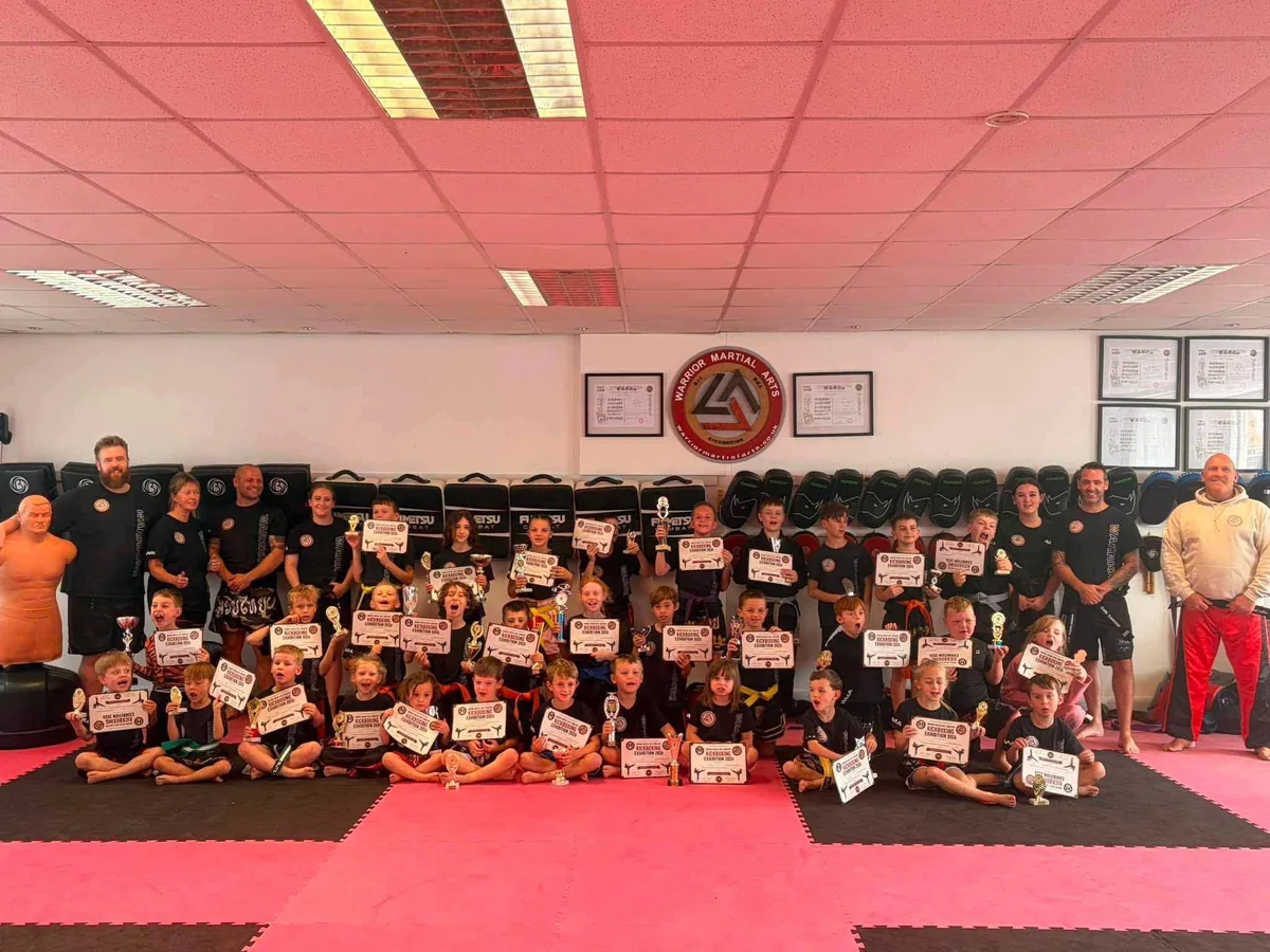 Warrior Martial Arts students and families celebrating their children’s fundraising event for Congleton Dog Rescue